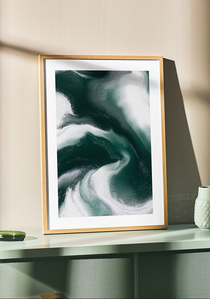 Framed contemporary abstract artwork "Measured Against" from the Infinite Studio series by Nicole Potrich featuring deep green and white fluid marble-inspired abstraction exploring comparison and emotional tension.