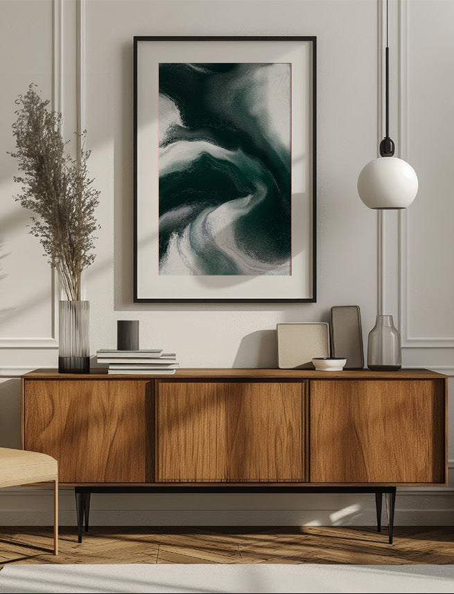 Framed contemporary abstract artwork "Measured Against" from the Infinite Studio series by Nicole Potrich featuring deep green and white fluid marble-inspired abstraction exploring comparison and emotional tension mounted on a wall in a modern livingroom.
