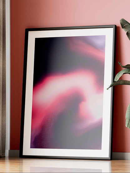 Framed contemporary abstract artwork "Becoming" from the Infinite Studio series by Nicole Potrich featuring magenta and black fluid marble-inspired abstraction symbolising transformation and emergence. Leaning on red wall.