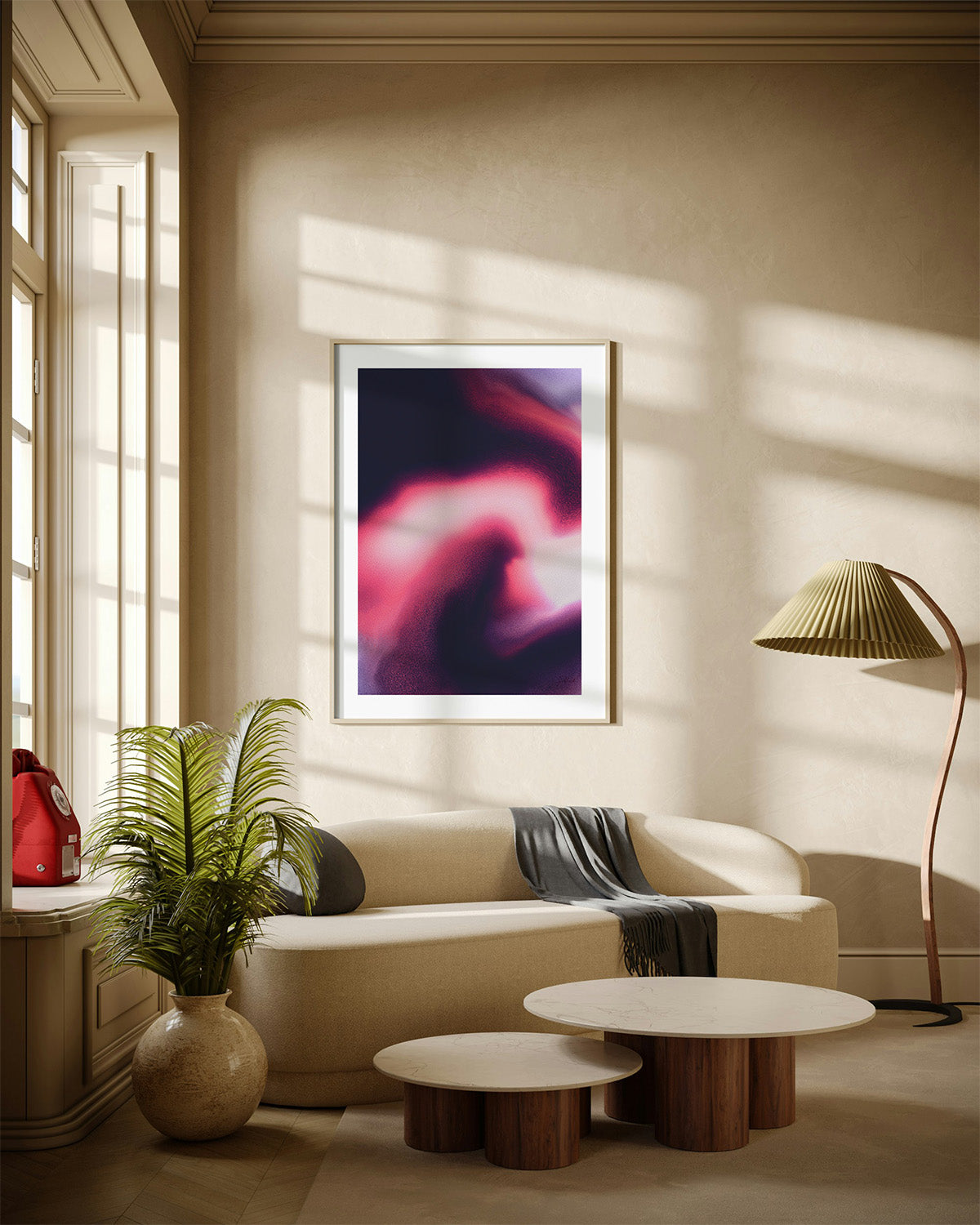 Framed contemporary abstract artwork "Becoming" from the Infinite Studio series by Nicole Potrich featuring magenta and black fluid marble-inspired abstraction symbolising transformation and emergence. Mounted on a wall in a cozy room.